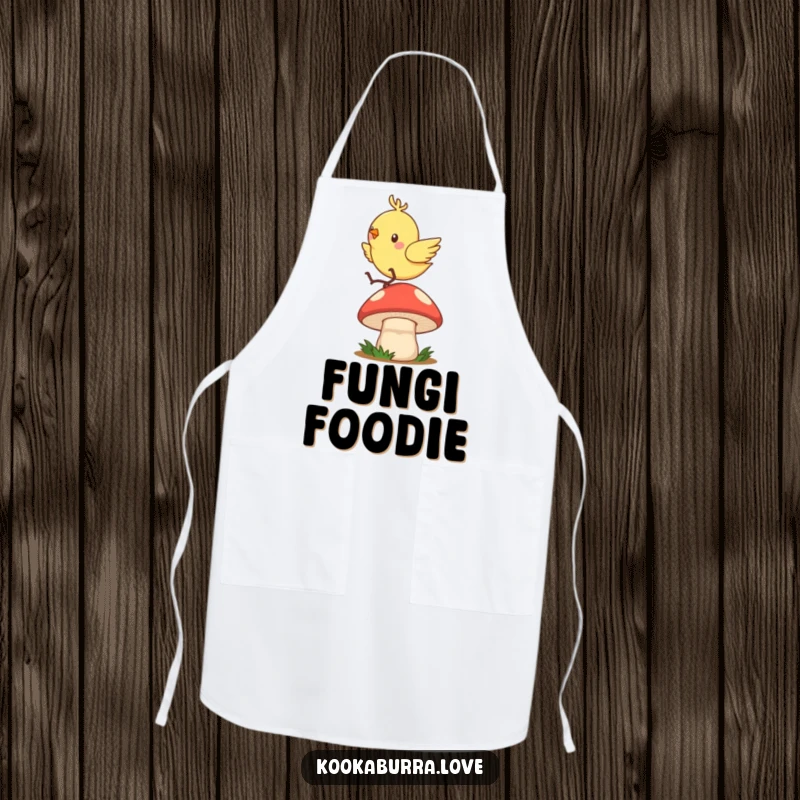Funny apron depicting a quick, zippy bird gleefully hopping and bouncing on a mushroom cap while cooking.