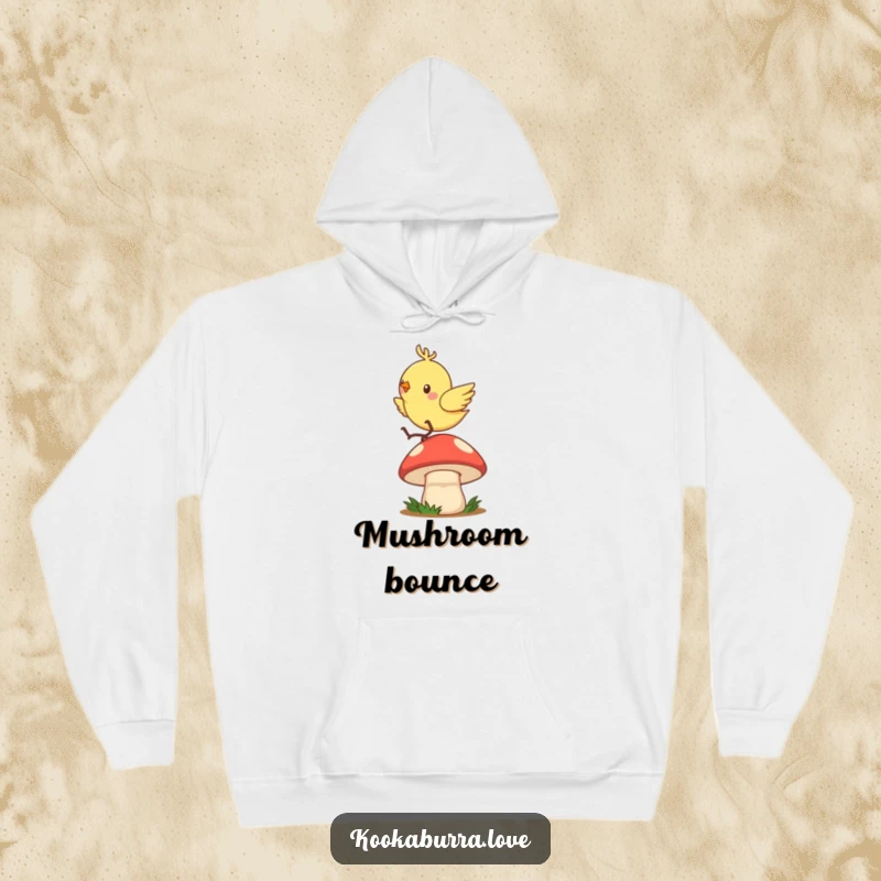 Funny hoodie depicting a quick, zippy bird joyfully hopping and bouncing with great enthusiasm on a mushroom cap.