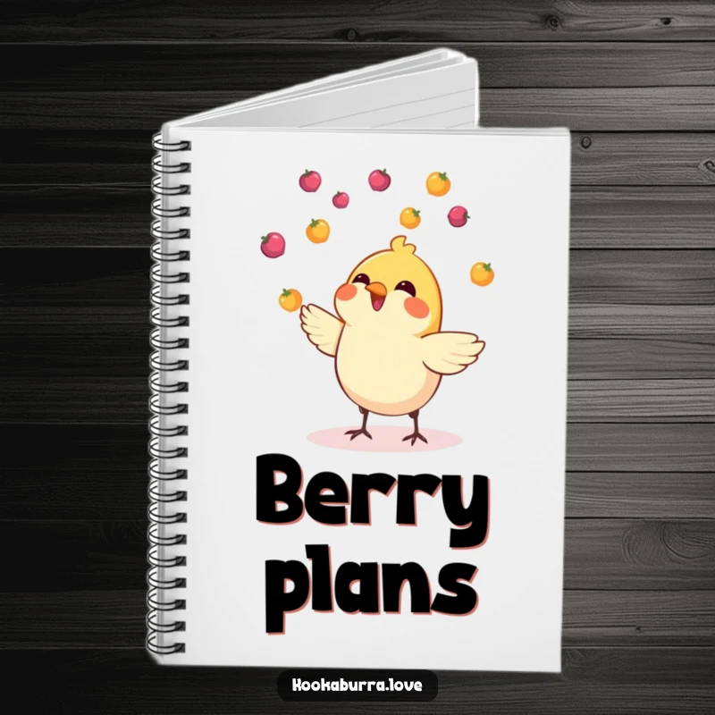 Funny notebook with a cover showing a small, cheerful bird adeptly juggling tiny, colorful berries.